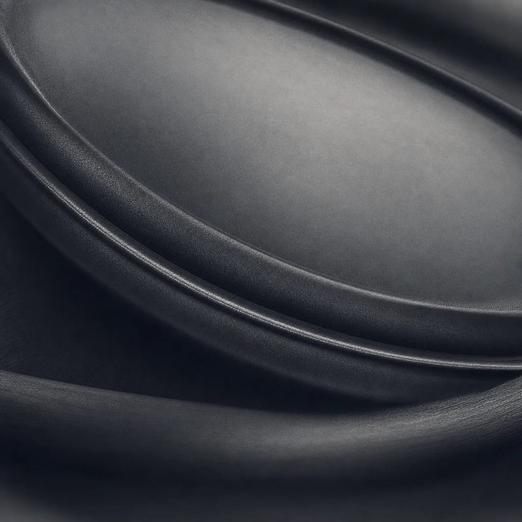 Stylized scene featuring an anatomically accurate stethoscope chestpiece, macro close-up of metal and rubber detail, rendered in charcoal gray #41454A