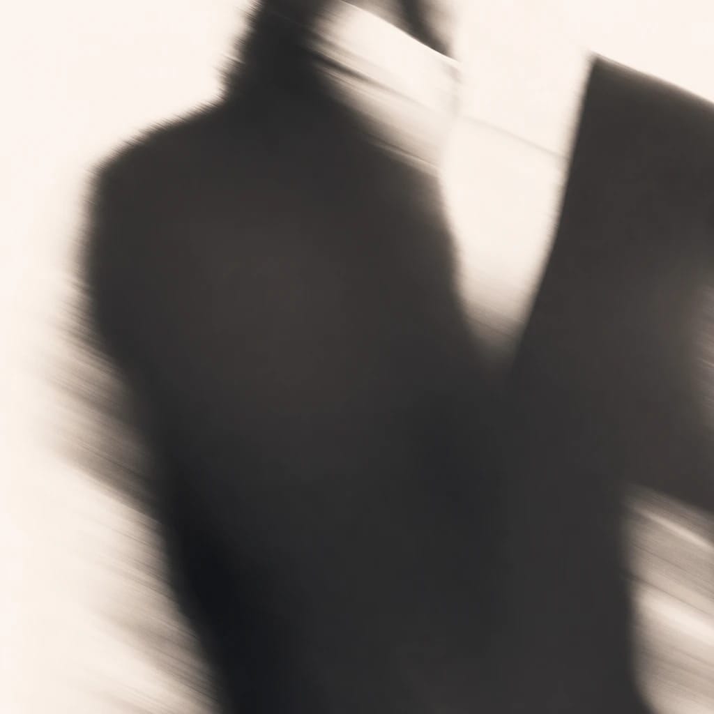 Stylized scene featuring a sharp business suit, crisply focused against a minimalist background, rendered in gray, off-white