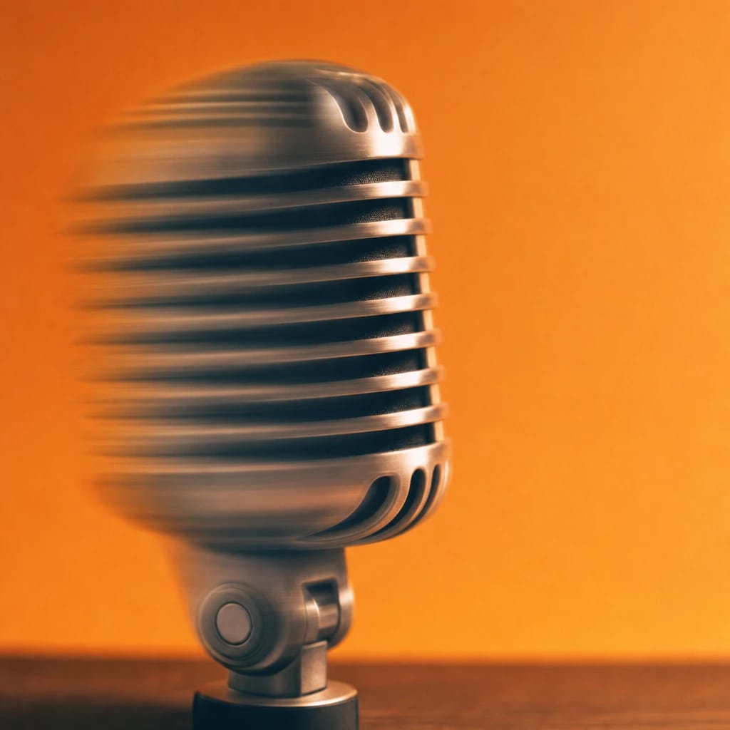 Stylized scene featuring a vintage microphone on a desk, softly out of focus, rendered in gray, off-white